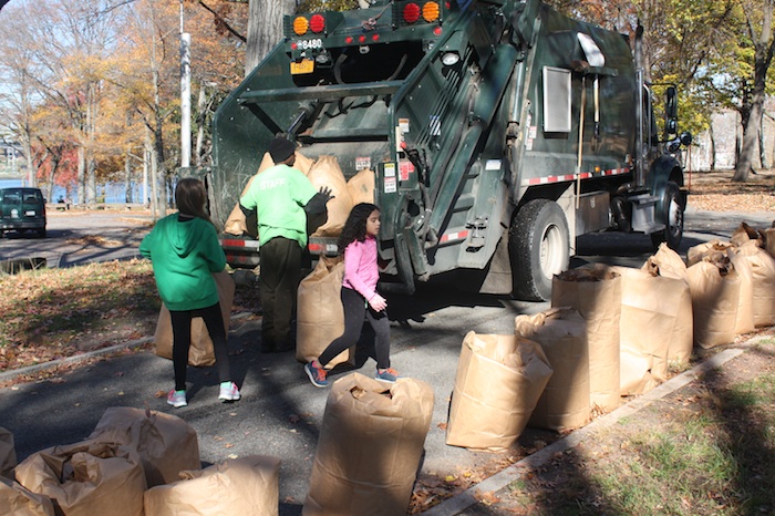 loading-bags-of-leaves-into-compactor-truck-leaf-fest-astoria-park-queens